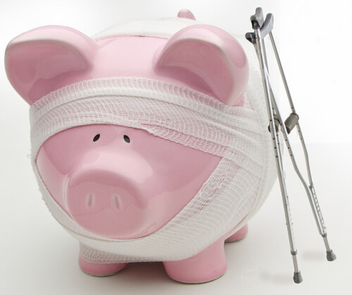 Injured piggy bank with crutches